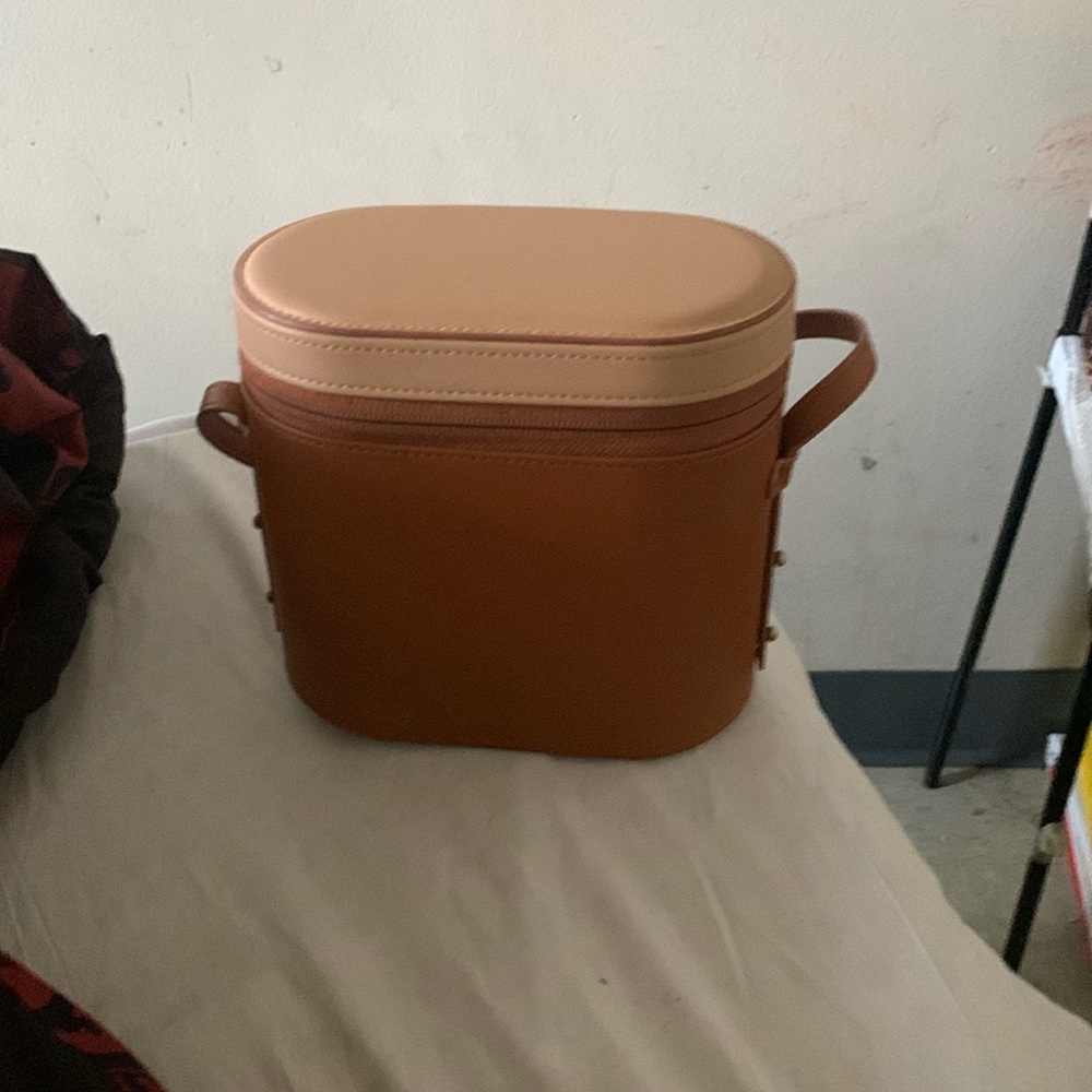 Zens purse. long strap. hard bottom in/out. stand up on his own.